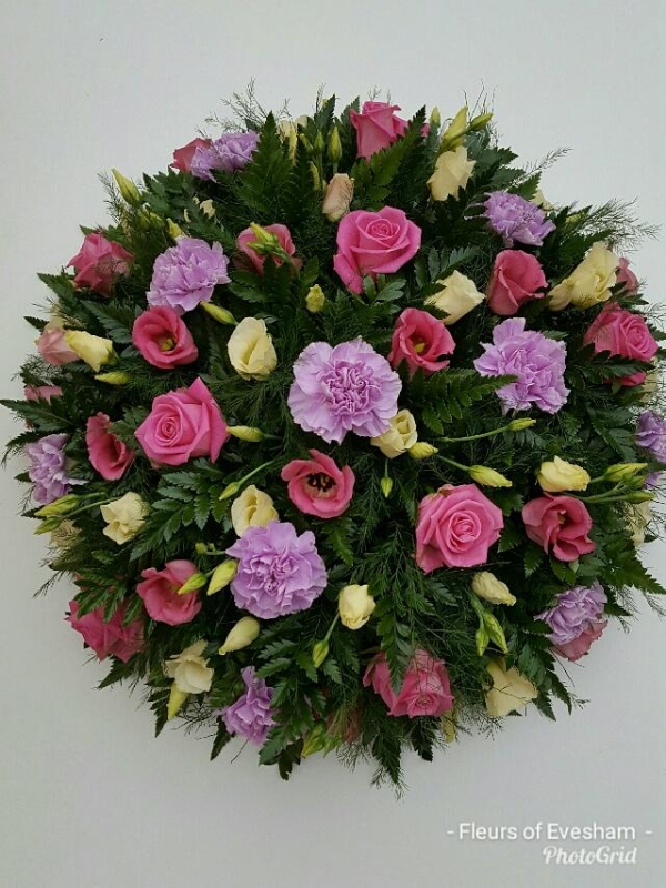 Rose, carnation and lisianthus funeral posy