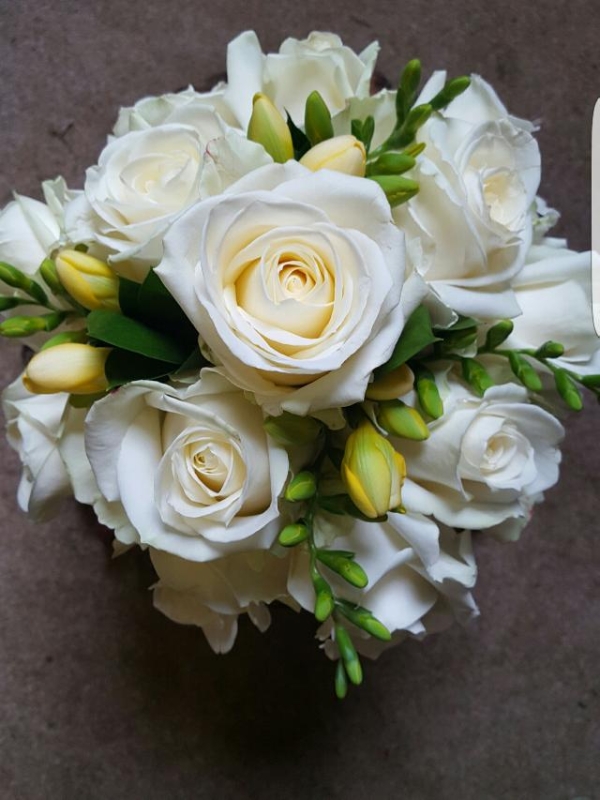 Bridesmaid hand tied roses and freesias