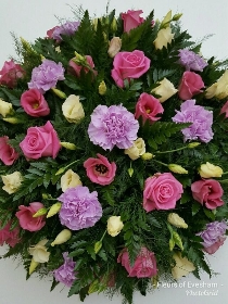 Rose, carnation and lisianthus funeral posy