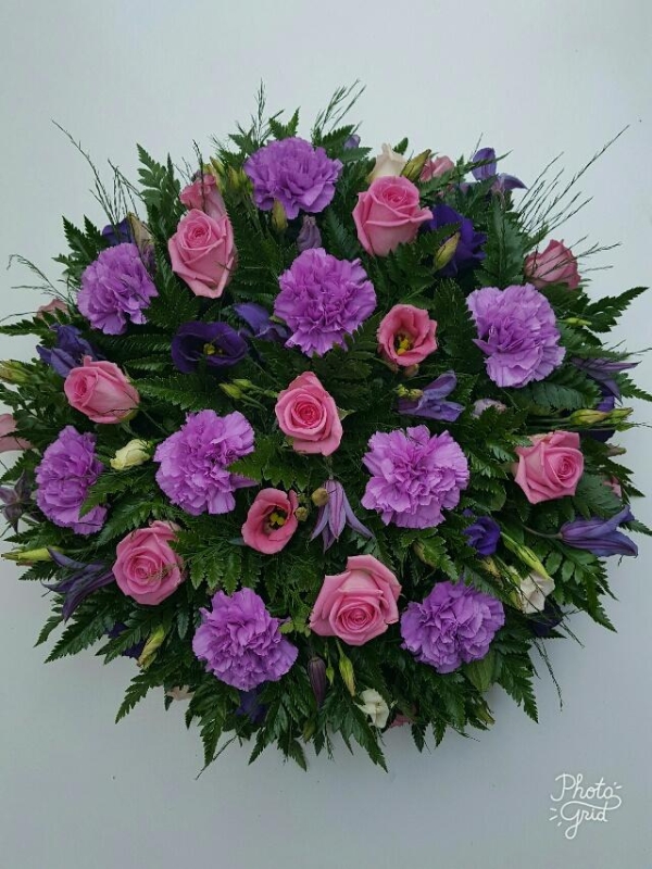 Rose, carnation and lisianthus funeral posy