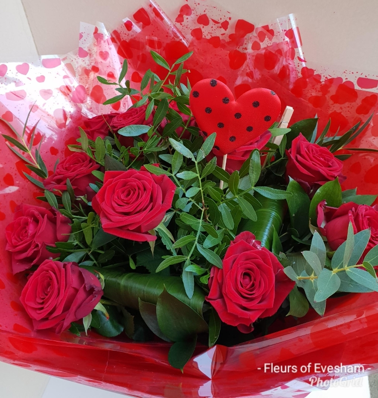 6 Red Roses and foliage   hand tied